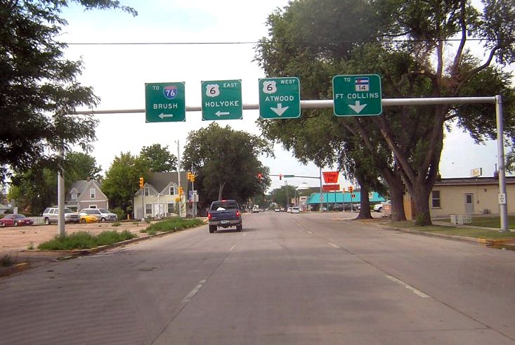 Overhead signs approaching the western endpoint of US 138 in Sterling, Colorado