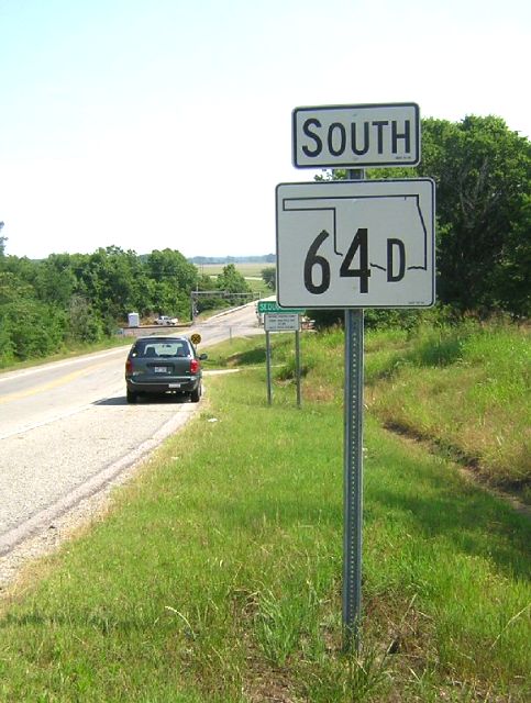 New-style (2006) Oklahoma marker for Oklahoma 64D just across the border from Dora, Arkansas