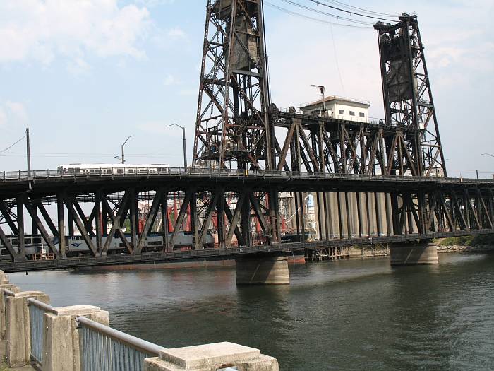 Amtrak train and light-rail MAX train on the Steel Bridge in Portland, Oregon