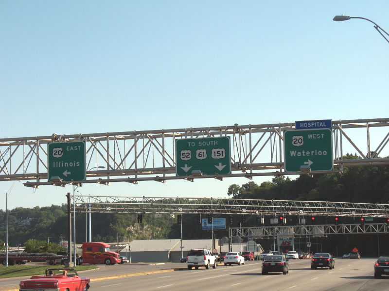 Multiple routes on freeway-style overhead signs on US 61 in downtown Dubuque, Iowa